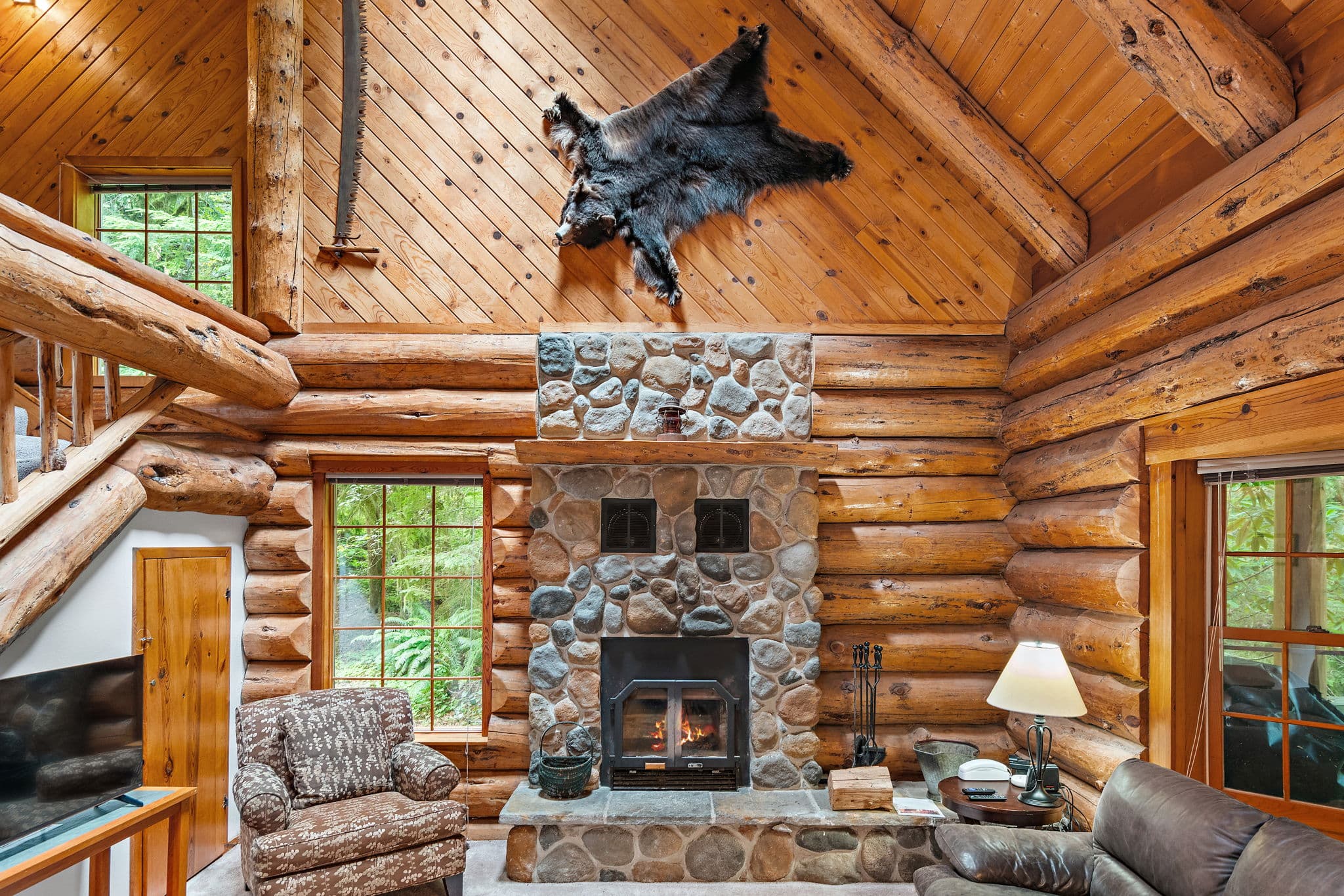 Wood-burning fireplace built from river rock.