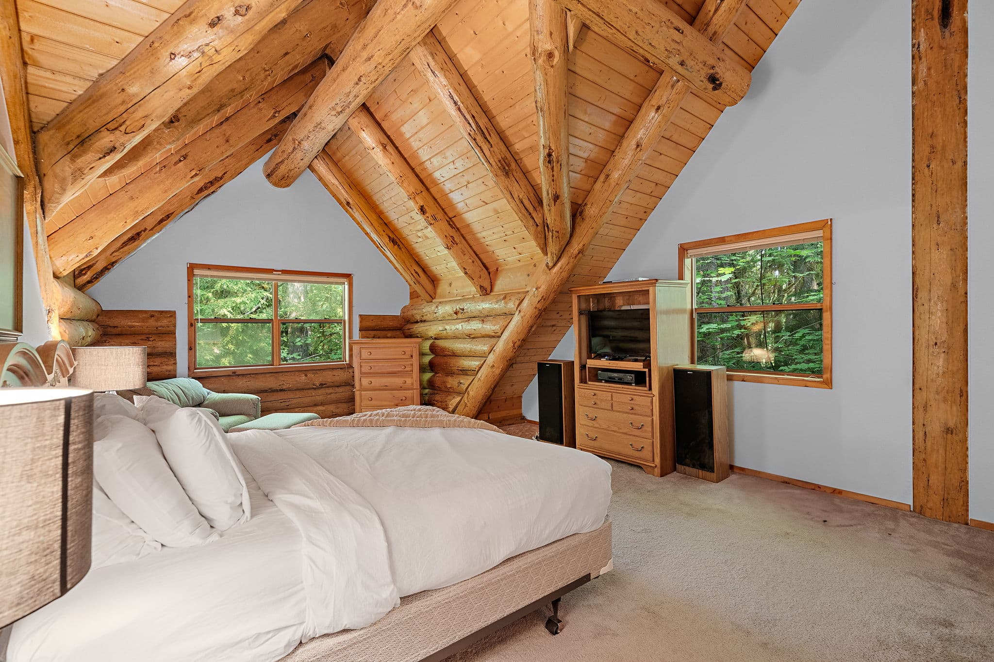 Upstairs master bedroom with a TV and dresser.