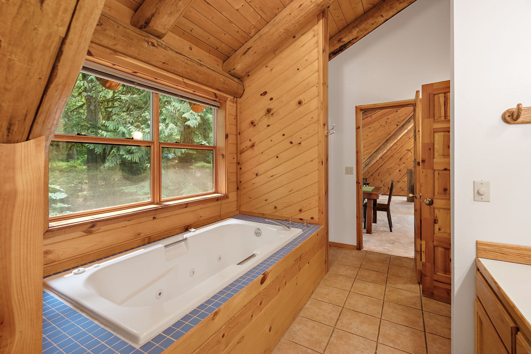Jetted tub with the loft landing just beyond.