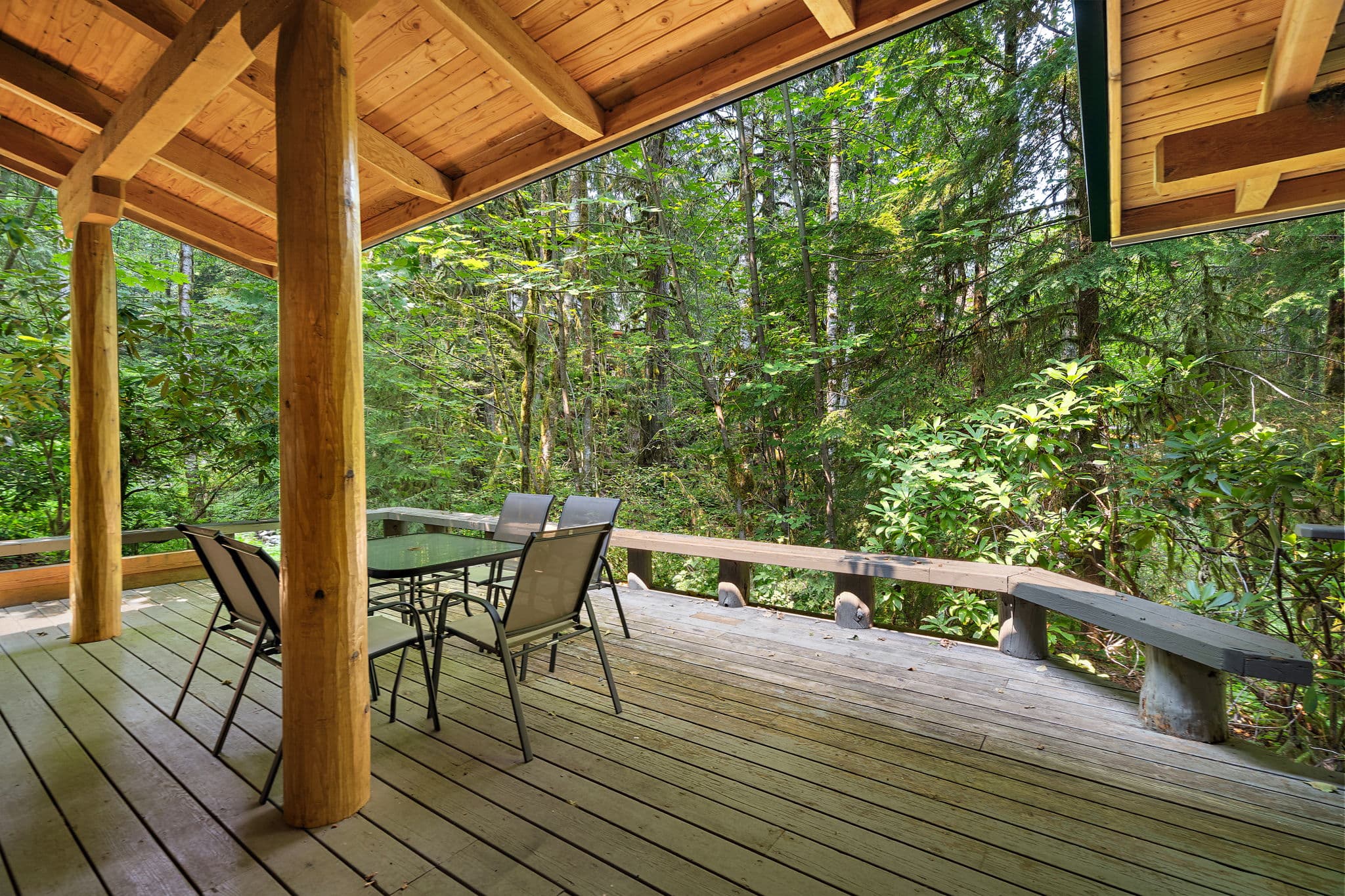 Covered deck with outdoor dining for four.
