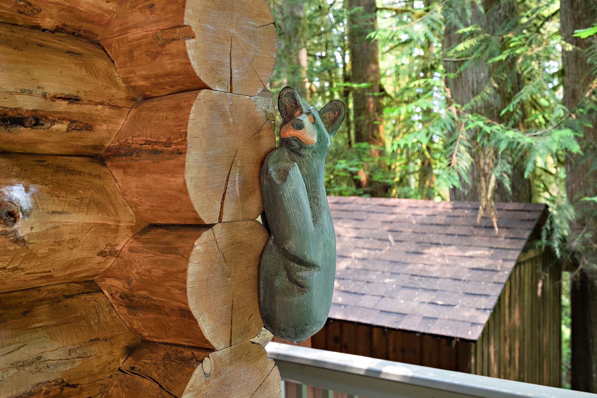 Carved bear on the porch post.