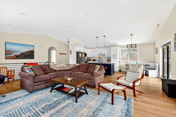 Open main floor with vaulted ceilings and views from the couch