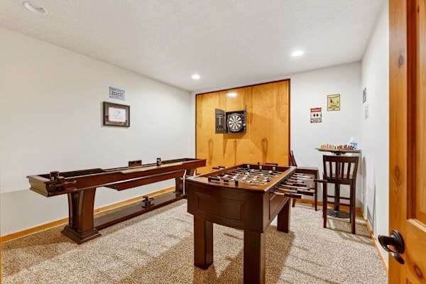 Game level, round one: shuffleboard, foosball, and darts.