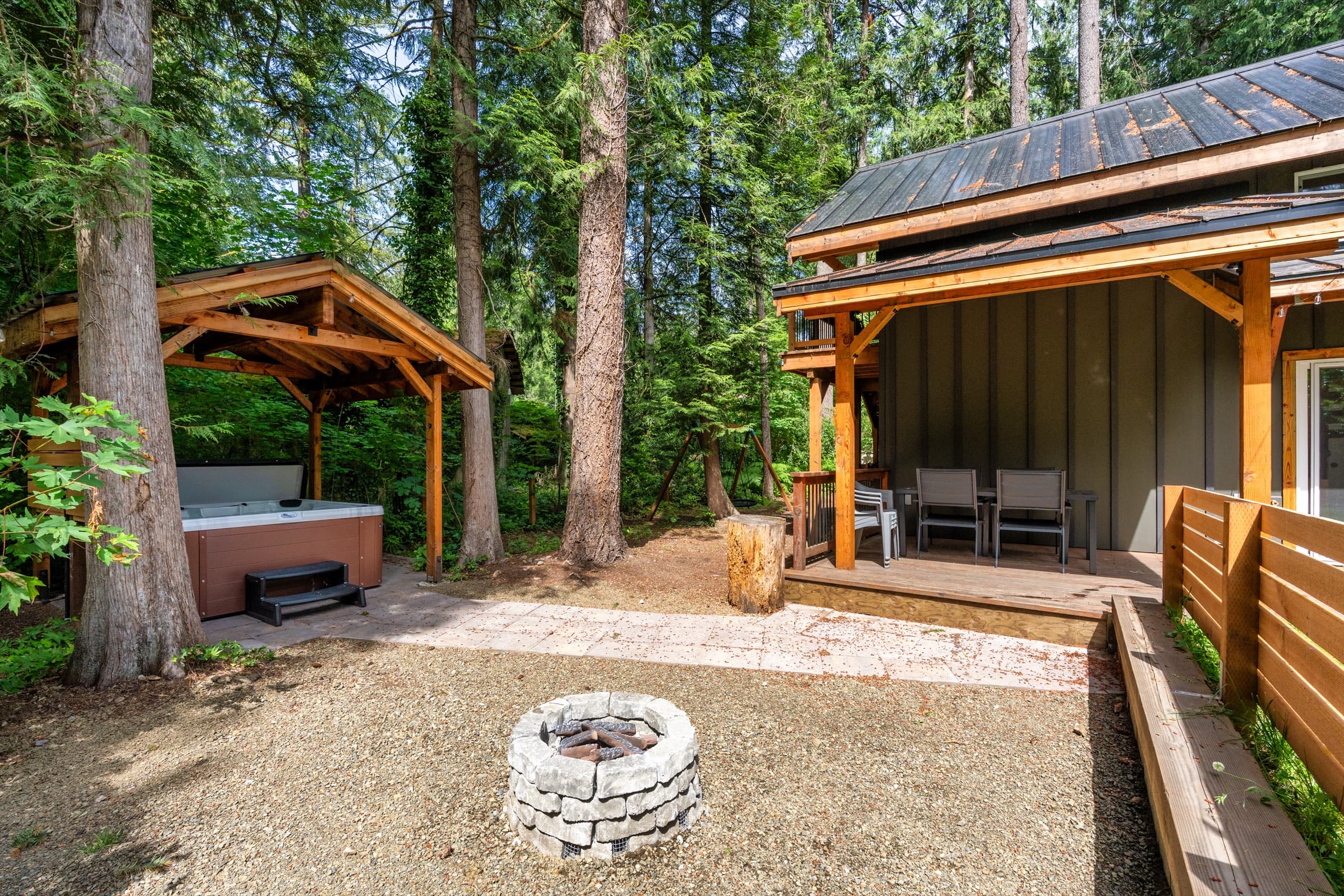 Propane fire pit in the courtyard, hot tub pavilion beyond.