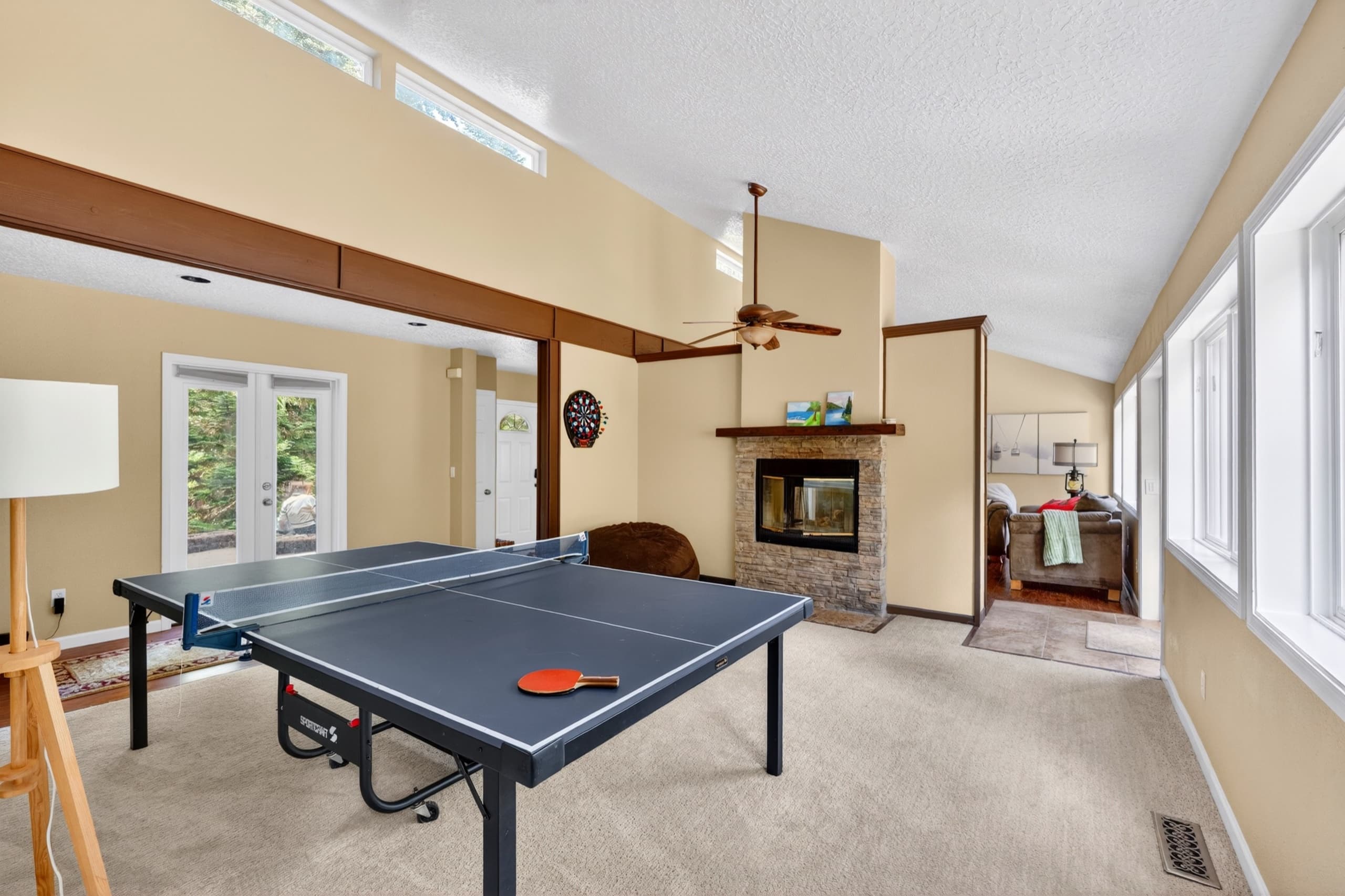 Game room with ping pong and fireplace.